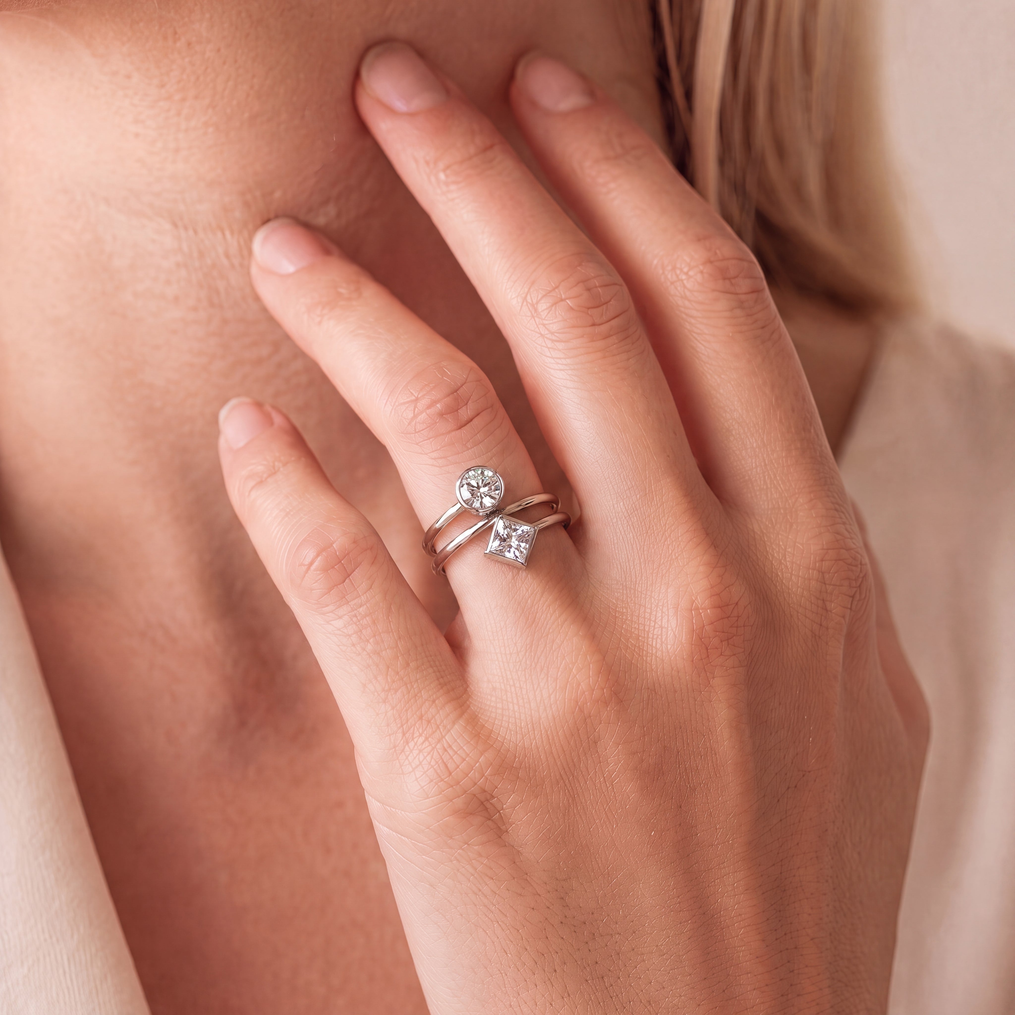 Spiral Two-Diamond Ring with Round and Princess-Cut Diamonds