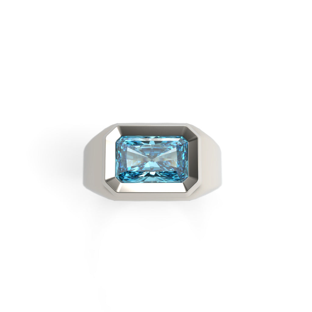 Top view of a 2 ct radiant-cut blue diamond set horizontally in a geometric signet ring