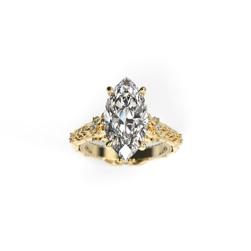 Front view of a yellow gold marquise diamond engagement ring with sculpted leaves and diamond accents.
