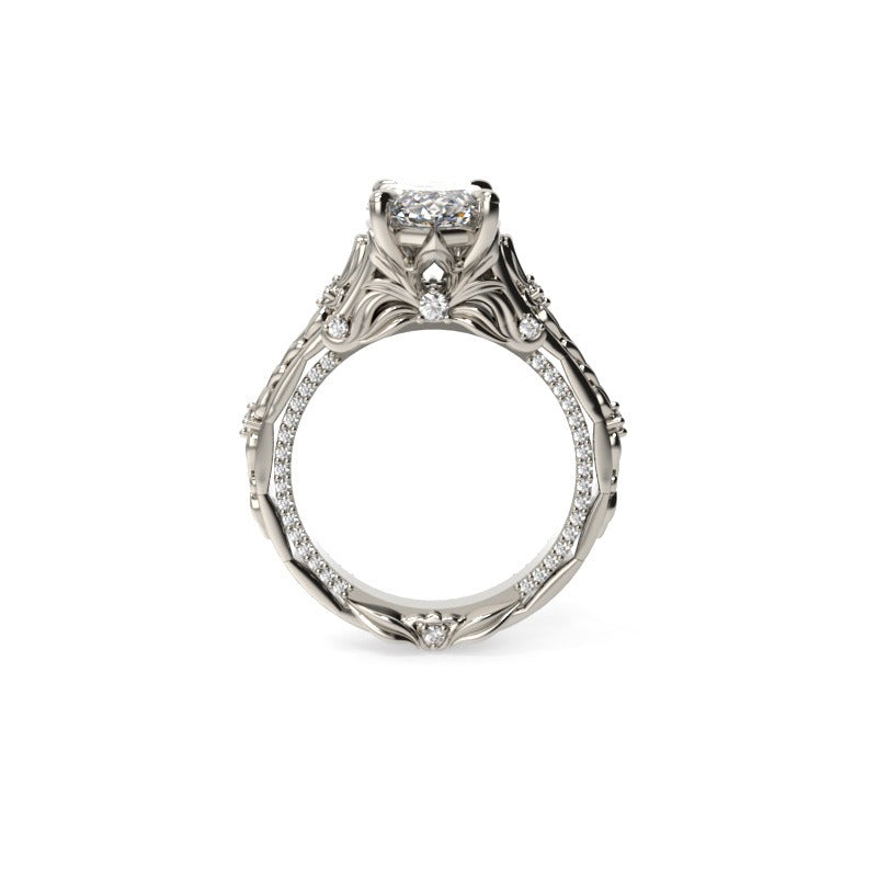 Side view of a floral marquise diamond engagement ring showing the sculpted gallery and leaf-detailed band.