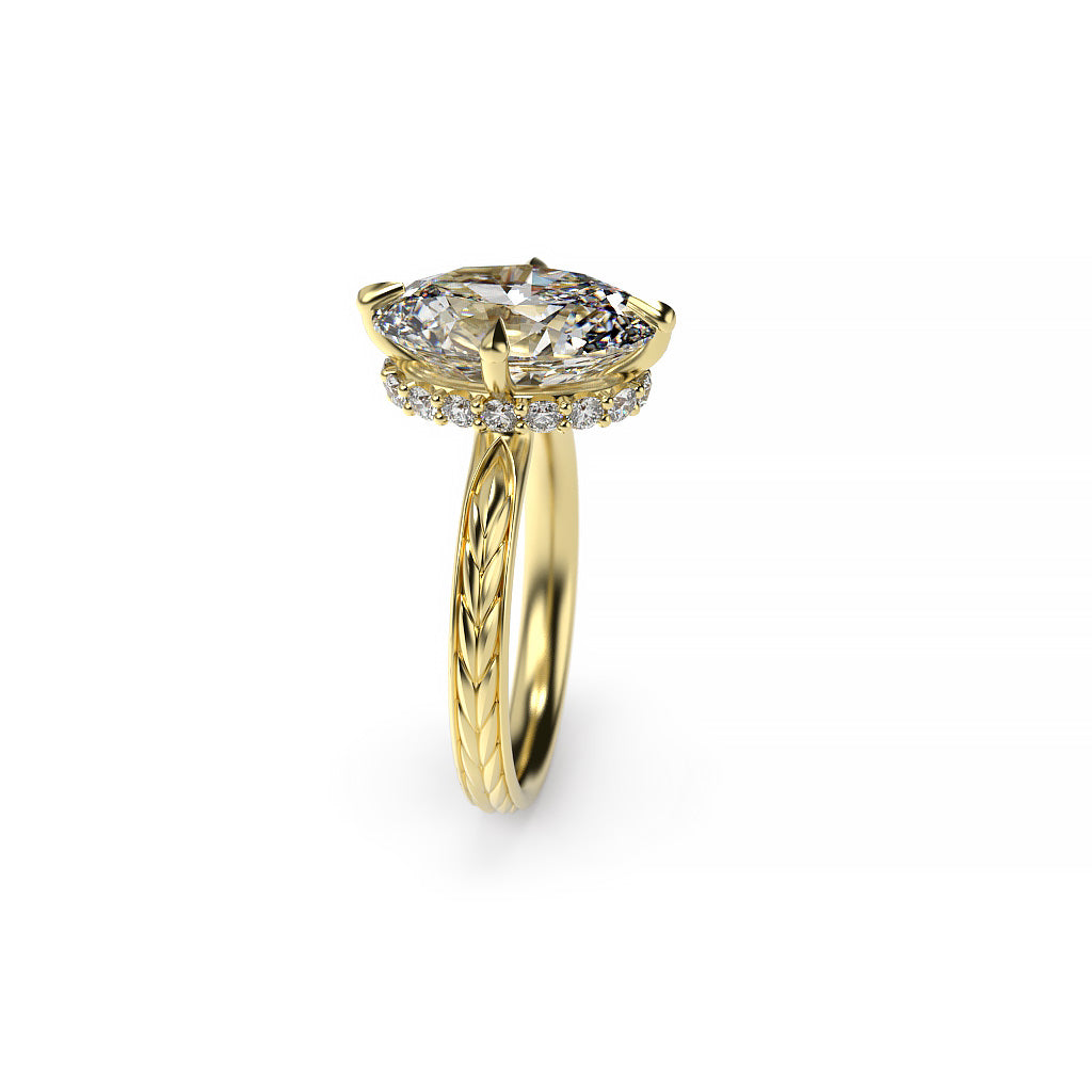 Side view of a yellow gold oval diamond hidden halo engagement ring with compass prongs, diamond accents, and a spikelet-inspired shank.