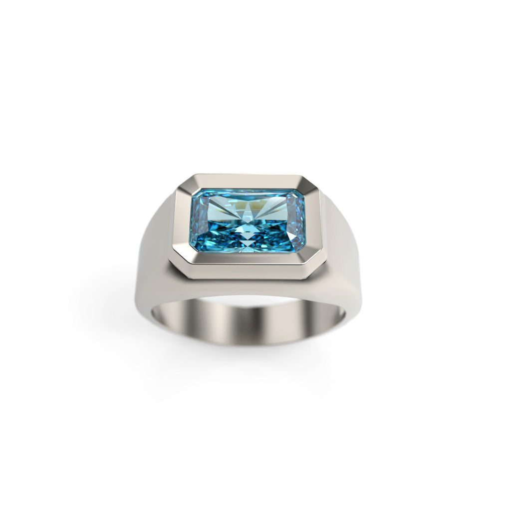 Front angled view of a men’s blue diamond signet ring with a wide beveled bezel