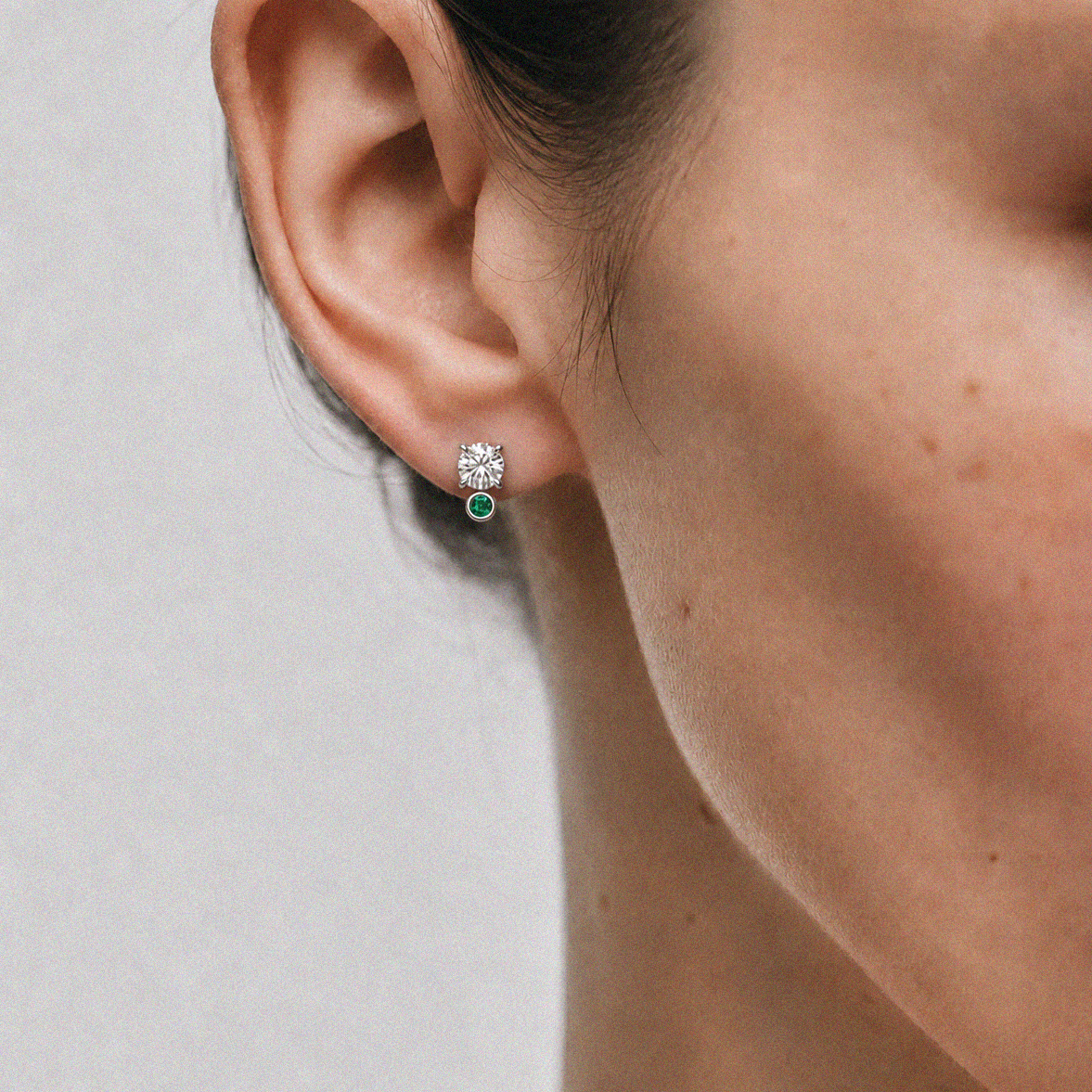 Round Diamond Halo Earrings with Emerald Accents