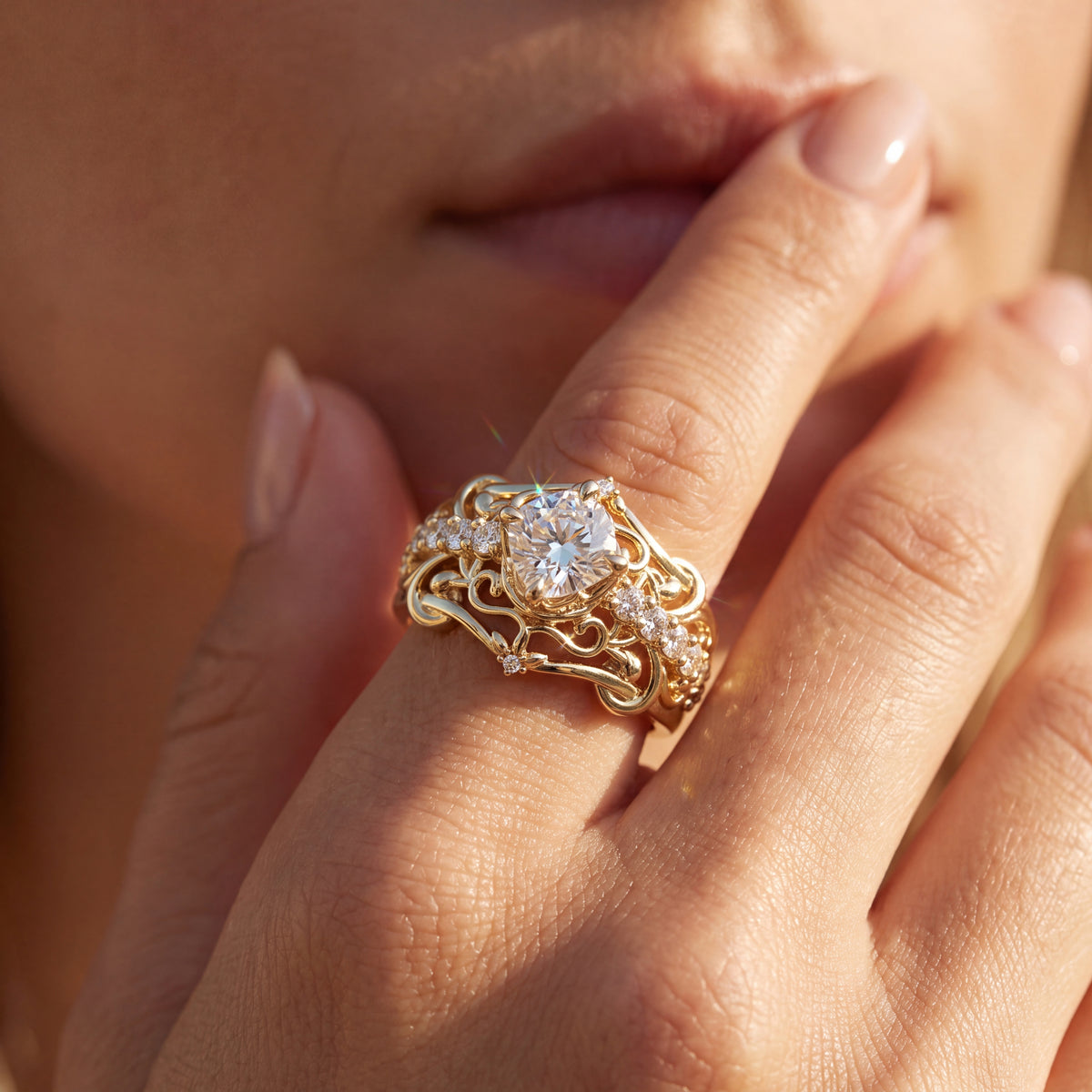 Engagement big round diamond ring with smaller accent stones, set against her face.
