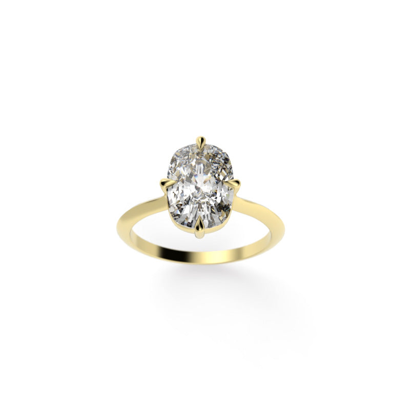 Front view of an elongated cushion diamond solitaire engagement ring with compass prongs and a yellow gold knife-edge band.