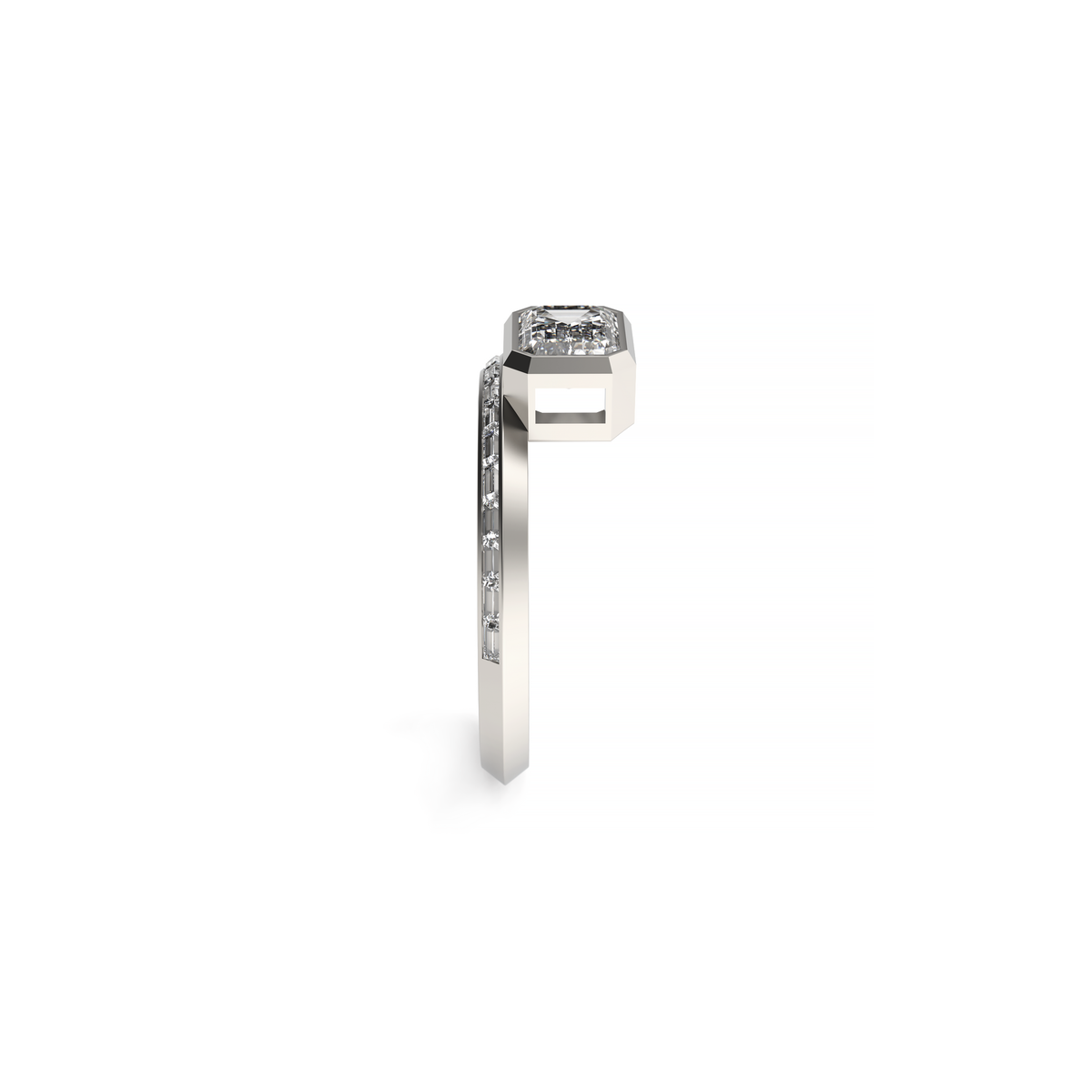 Side view of a white gold emerald-cut diamond ring with baguette diamonds on the band.